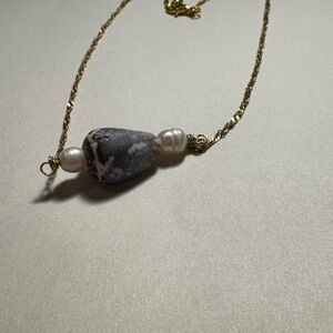 Handcrafted gold cone shell necklace with natural pearls